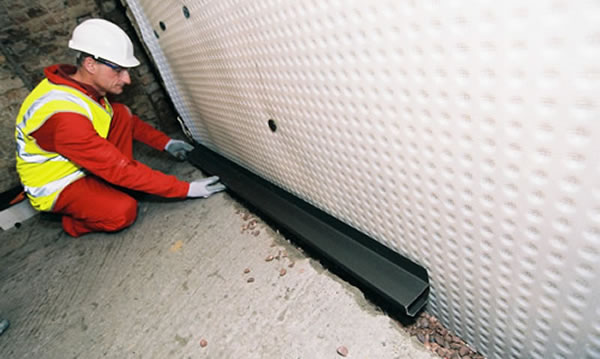 Waterproof work - a builder working on a commercial building - siteseal concrete repairs